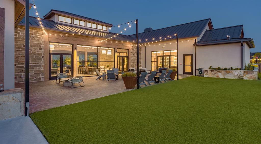 854 Stoney Bridge Way Lavon, TX 75166 - Photo 35 of 36 a view of a patio with table and chairs potted plants and wooden fence
