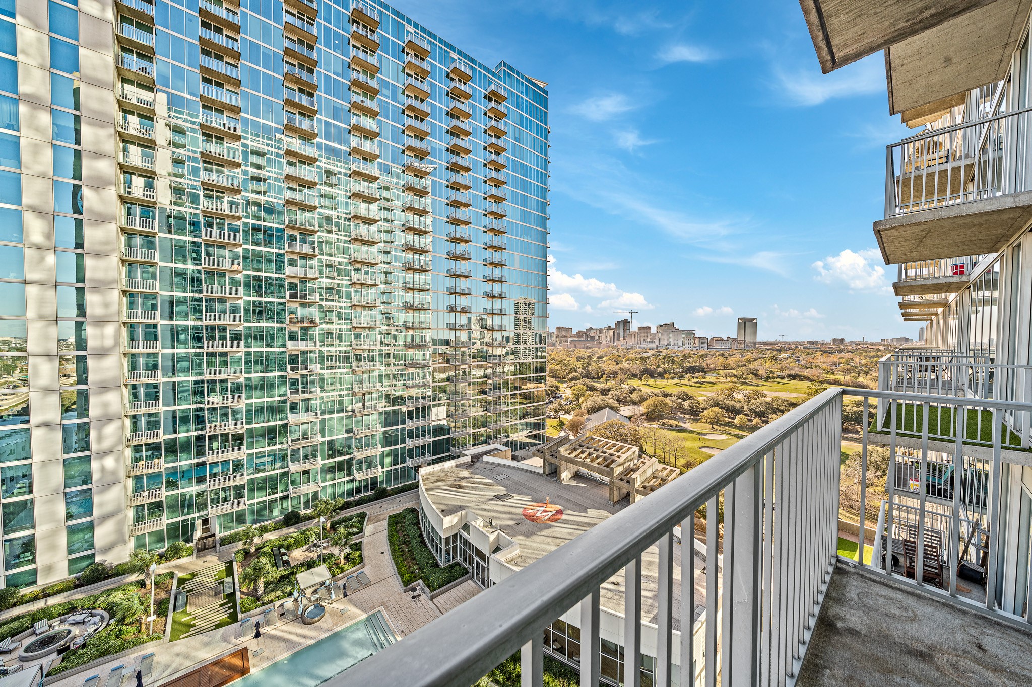 5925 Almeda Road, Unit 11406 Houston, TX 77004 - Photo 12 of 26 a view of a balcony with a floor to ceiling window stairs and a city view