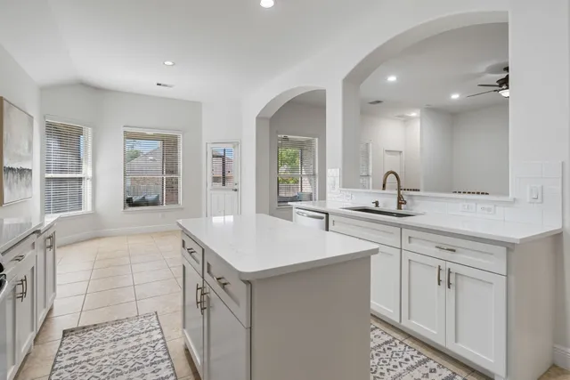 a kitchen with a sink and cabinets