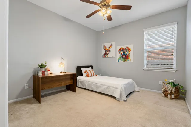 a bed room with a bed and a window