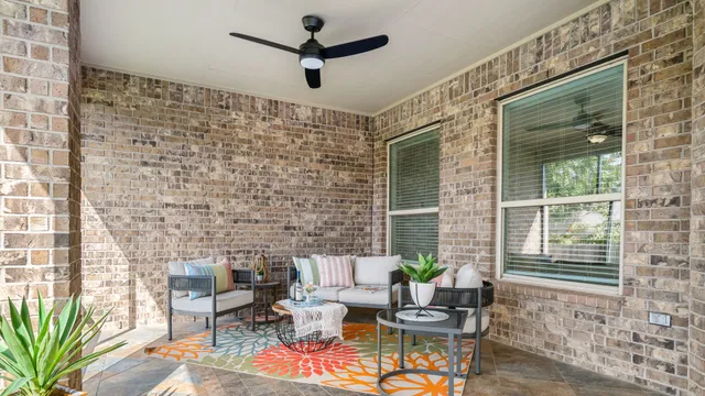 a living room with patio furniture and a window