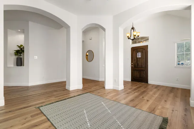 wooden floor in an empty room and a window