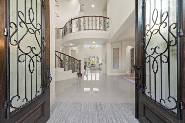 a view of an entryway with wooden floor