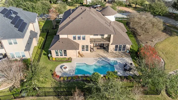 an aerial view of a house with garden space ocean view