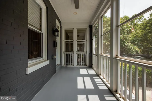 a view of a balcony with wooden floor