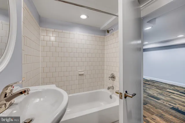 a bathroom with a sink and shower