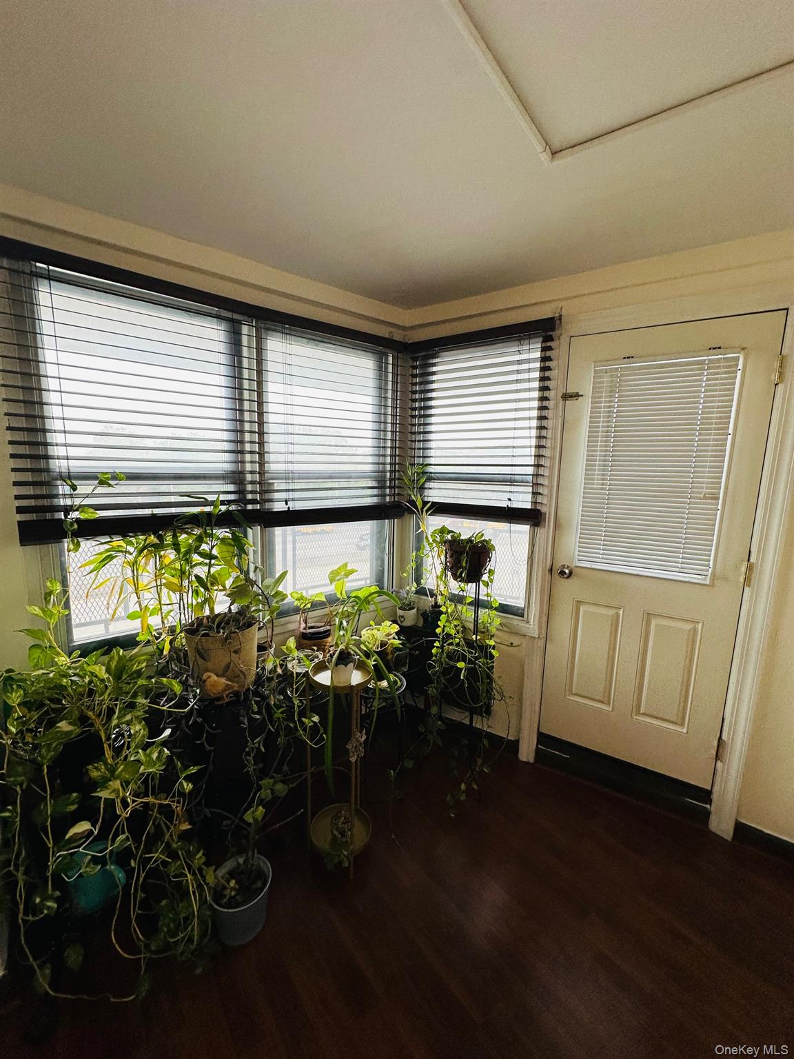3121 Middletown Road, Unit 4K Bronx, NY 10461 - Photo 21 of 30 a room with lots of wooden furniture and windows