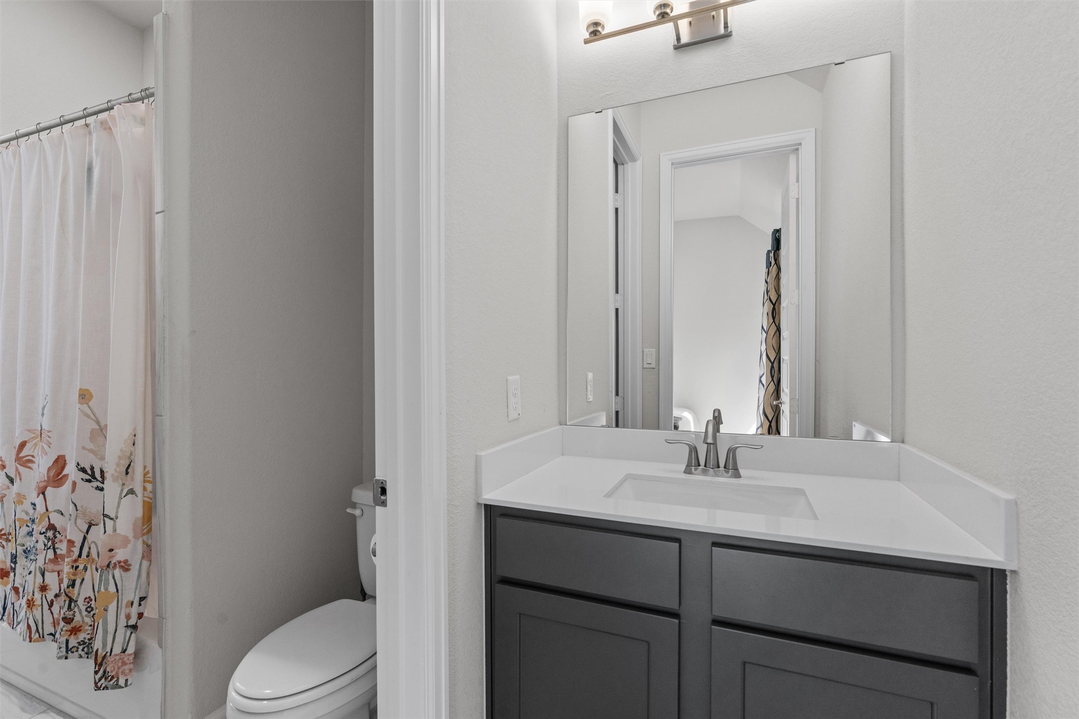 101 Pienza Drive Georgetown, TX 78628 - Photo 29 of 40 a bathroom with a sink a toilet and shower
