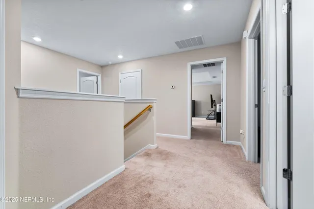 a bedroom with a bed and a ceiling fan