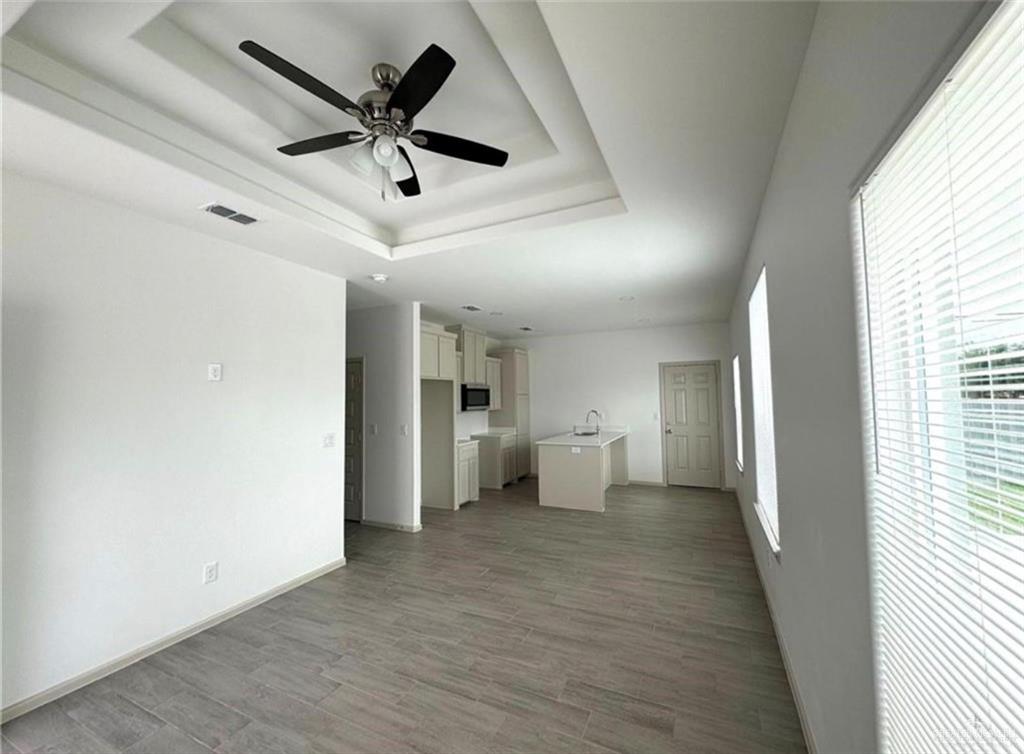 7710 North 58th Street, Unit 2 Mission, TX 78573 - Photo 2 of 13 a view of empty room with wooden floor and ceiling fan
