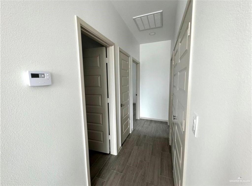 7710 North 58th Street, Unit 2 Mission, TX 78573 - Photo 4 of 13 a view of a hallway with wooden floor
