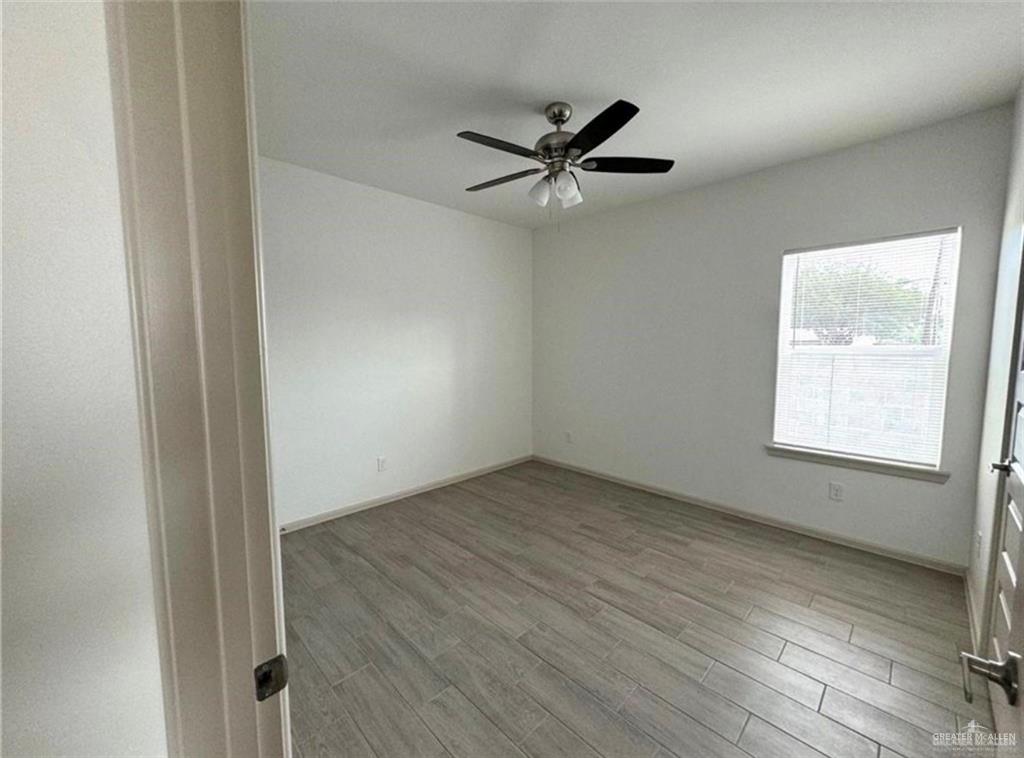 7710 North 58th Street, Unit 2 Mission, TX 78573 - Photo 9 of 13 an empty room with a window