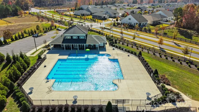 a view of a swimming pool with seating area