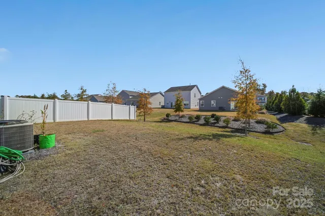 a view of swimming pool with a yard