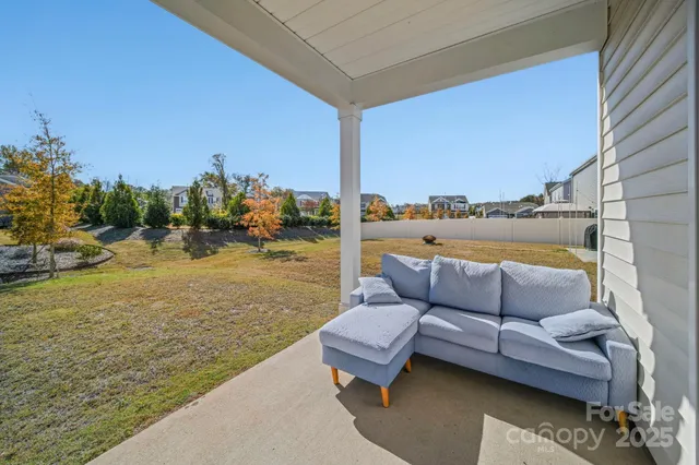 aerial view of a house with a yard
