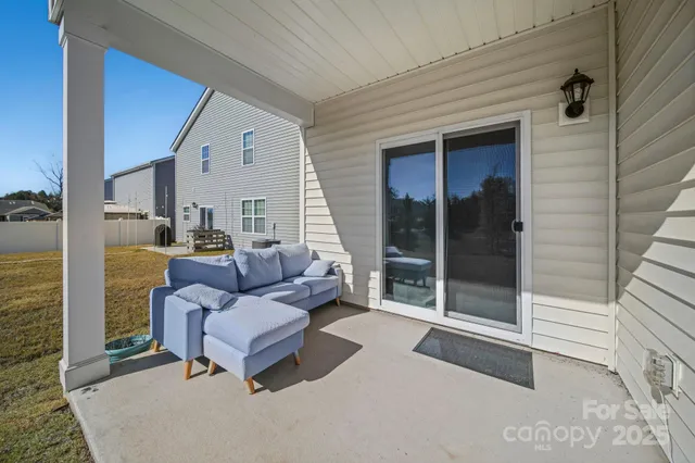 a view of a swimming pool with a yard and mountain view