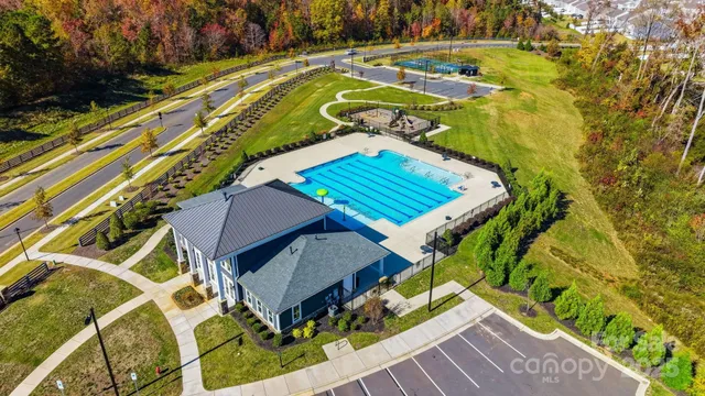 an aerial view of a house with a ocean view