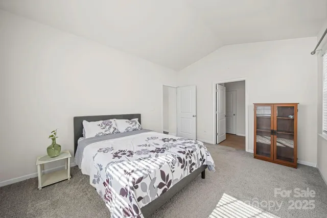 a bedroom with a bed and a chair