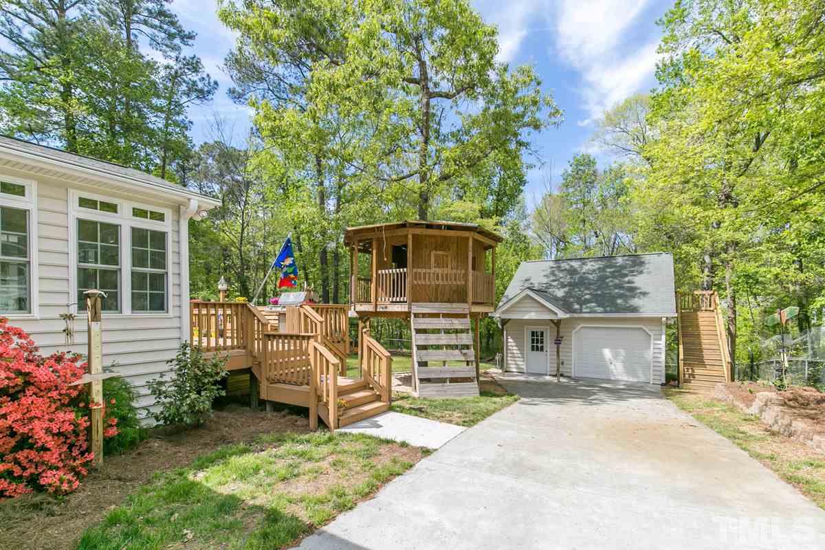 4025 Iverson Street Raleigh, NC 27604 - Photo 22 of 24 front view of a house with a garden