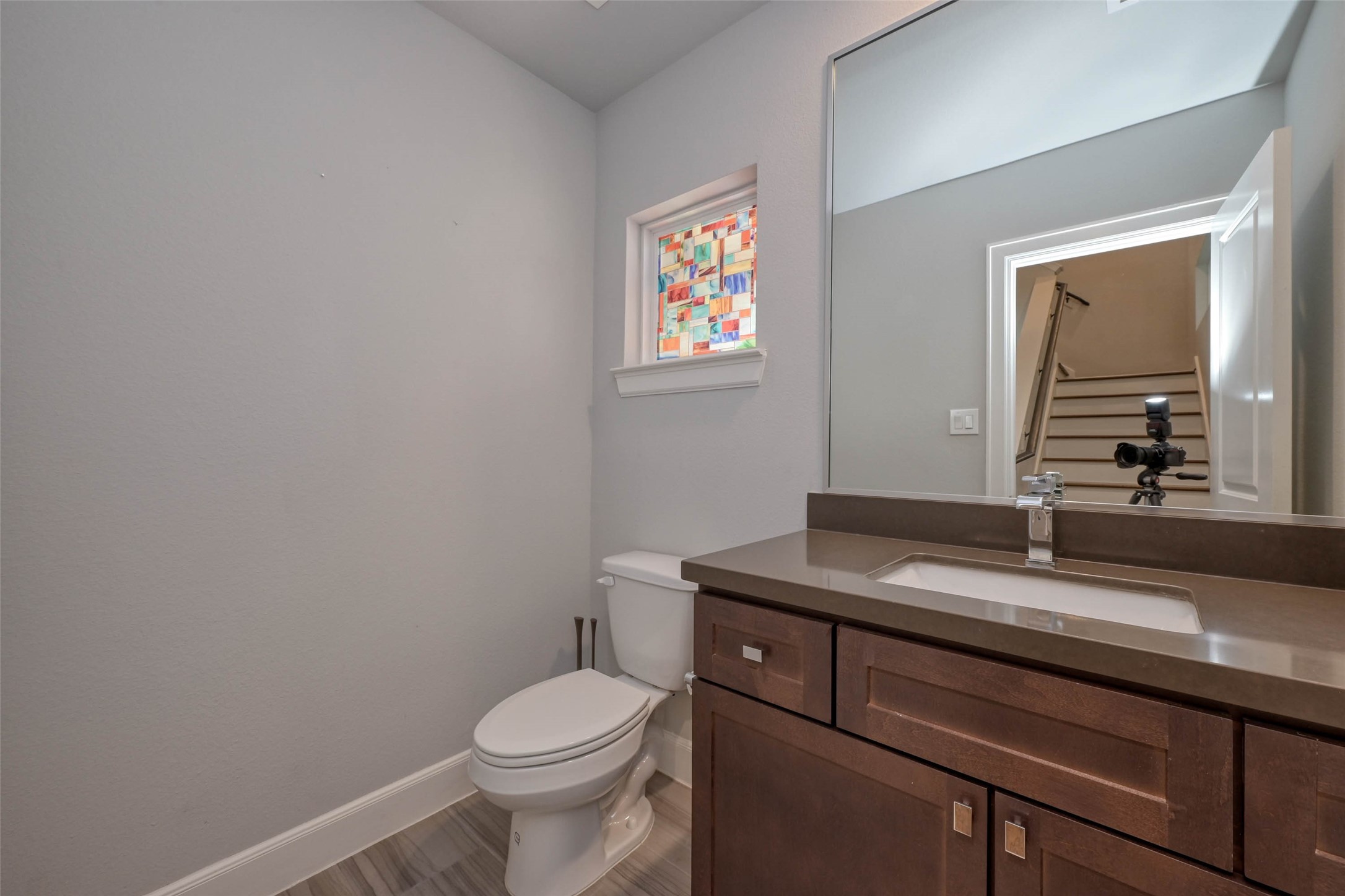 951 West 17th Street Houston, TX 77008 - Photo 16 of 30 a bathroom with a granite countertop toilet sink and mirror
