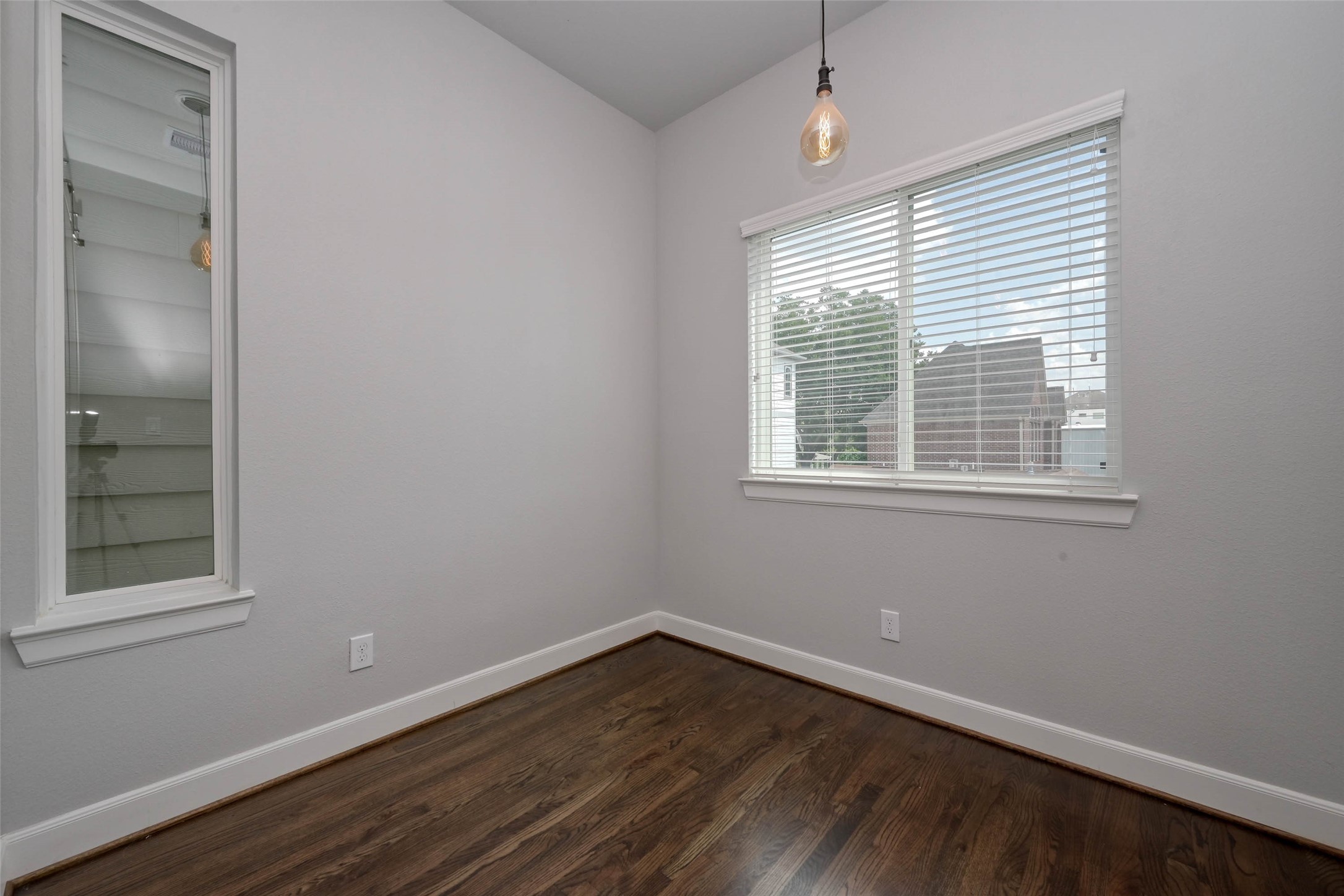951 West 17th Street Houston, TX 77008 - Photo 18 of 30 a view of an empty room with wooden floor and a window