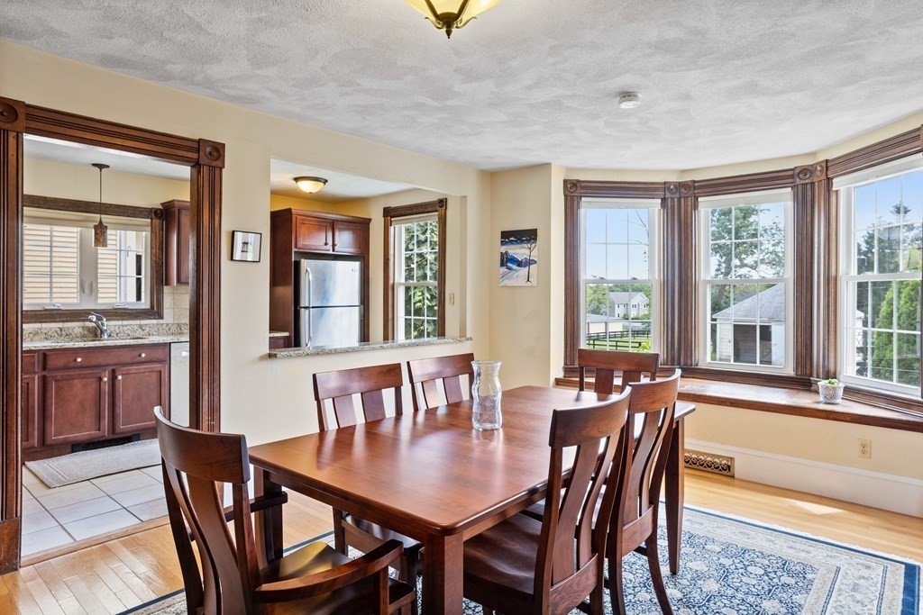 120 Goldsmith Street, Unit 3 Littleton, MA 01460 - Photo 11 of 33 a view of a dining room with furniture window and outside view