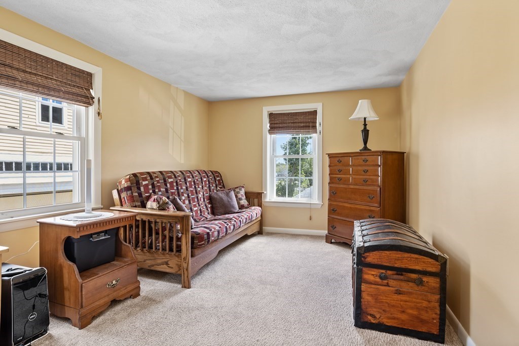 120 Goldsmith Street, Unit 3 Littleton, MA 01460 - Photo 21 of 33 a bedroom with furniture and a window
