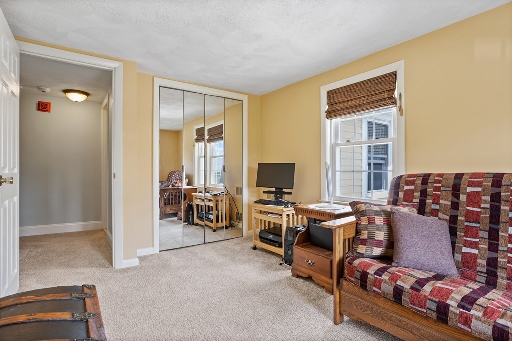 120 Goldsmith Street, Unit 3 Littleton, MA 01460 - Photo 22 of 33 a view of a livingroom with workspace and a window