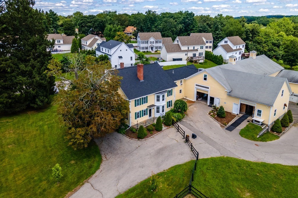 120 Goldsmith Street, Unit 3 Littleton, MA 01460 - Photo 26 of 33 an aerial view of multiple houses with a yard