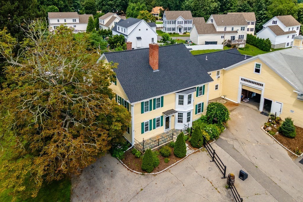 120 Goldsmith Street, Unit 3 Littleton, MA 01460 - Photo 3 of 33 an aerial view of a house with a garden