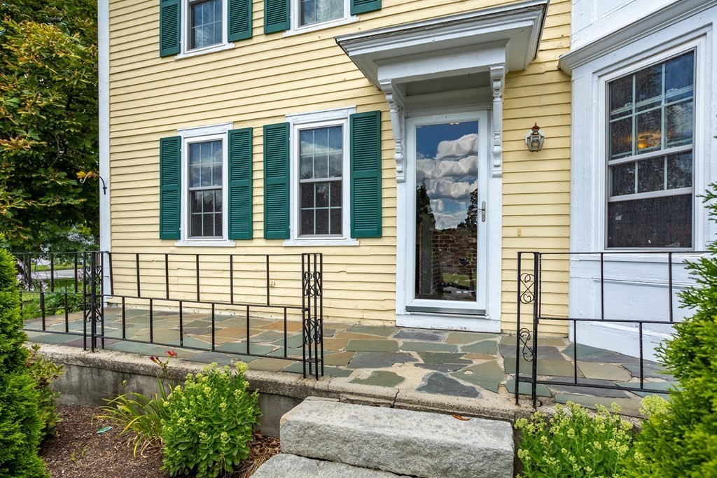 120 Goldsmith Street, Unit 3 Littleton, MA 01460 - Photo 5 of 33 a view of a brick house with large windows