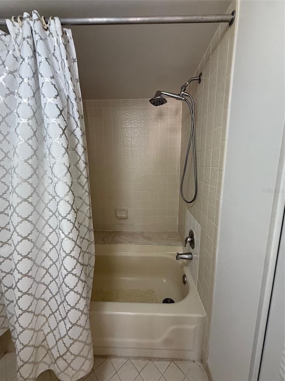 6206 Raintree Drive, Unit GE Orlando, FL 32822 - Photo 12 of 18 a bathroom with a shower