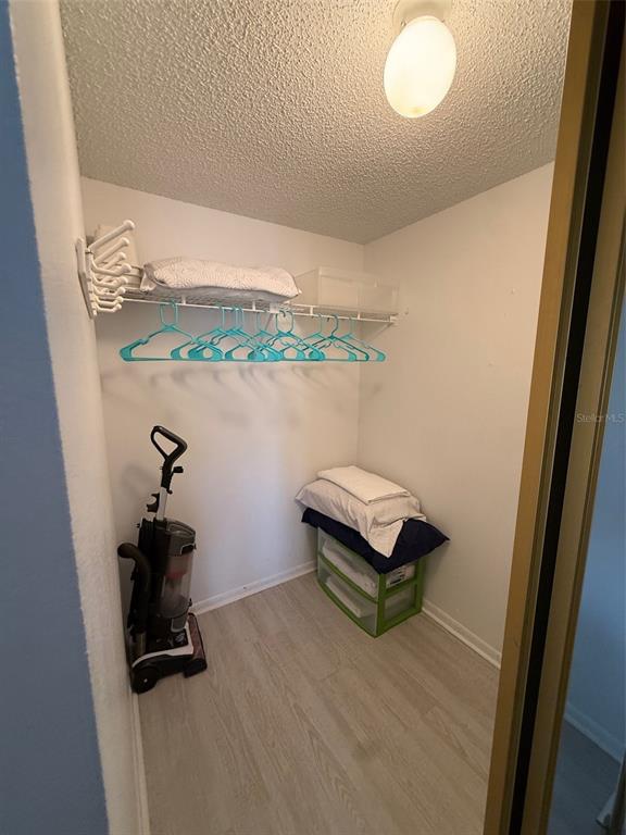 6206 Raintree Drive, Unit GE Orlando, FL 32822 - Photo 13 of 18 a room with a bench