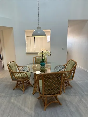 a dining room with furniture and window