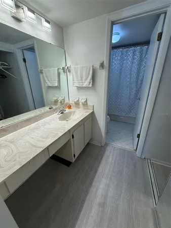 a bathroom with a double vanity sink and mirror