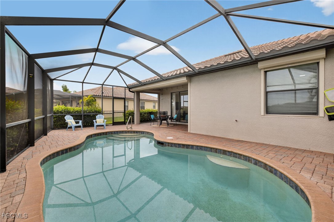 2727 Via Piazza Loop Fort Myers, FL 33905 - Photo 3 of 35 a view of a backyard with a swimming pool