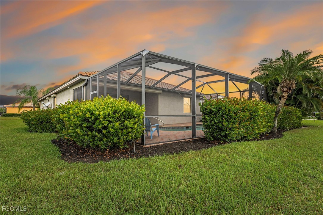 2727 Via Piazza Loop Fort Myers, FL 33905 - Photo 33 of 35 front view of a house with a small yard