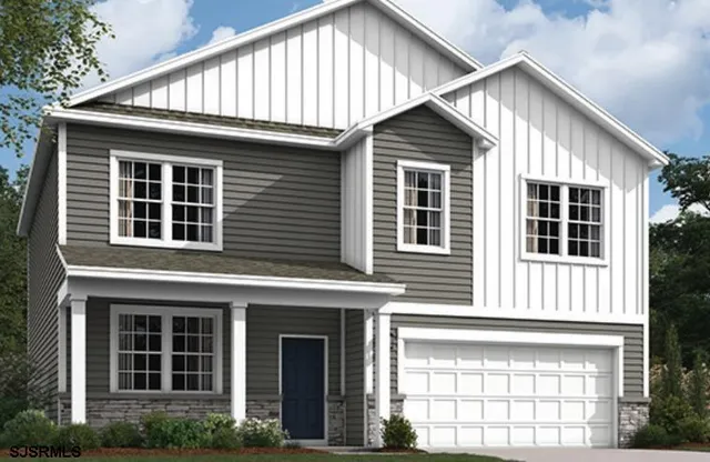 a front view of a house with a yard and balcony