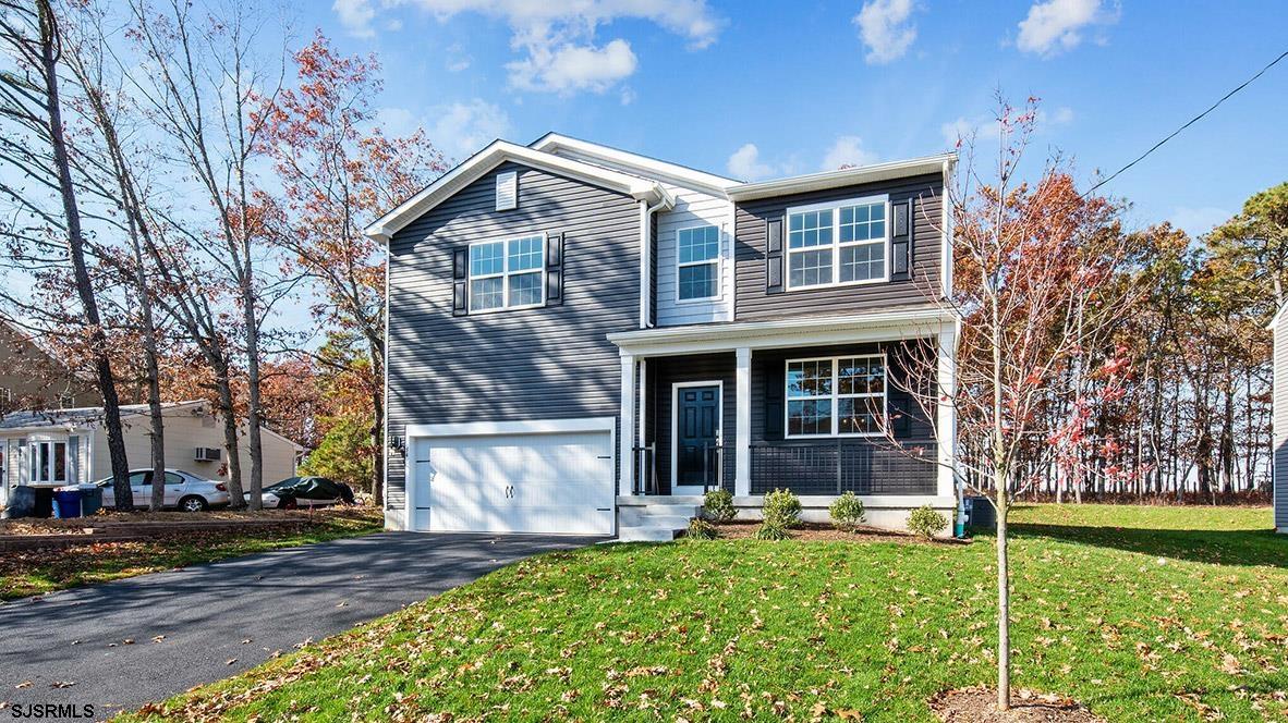 7 Emilie Court Richland, NJ 08350 - Photo 1 of 23 a front view of a house with garden