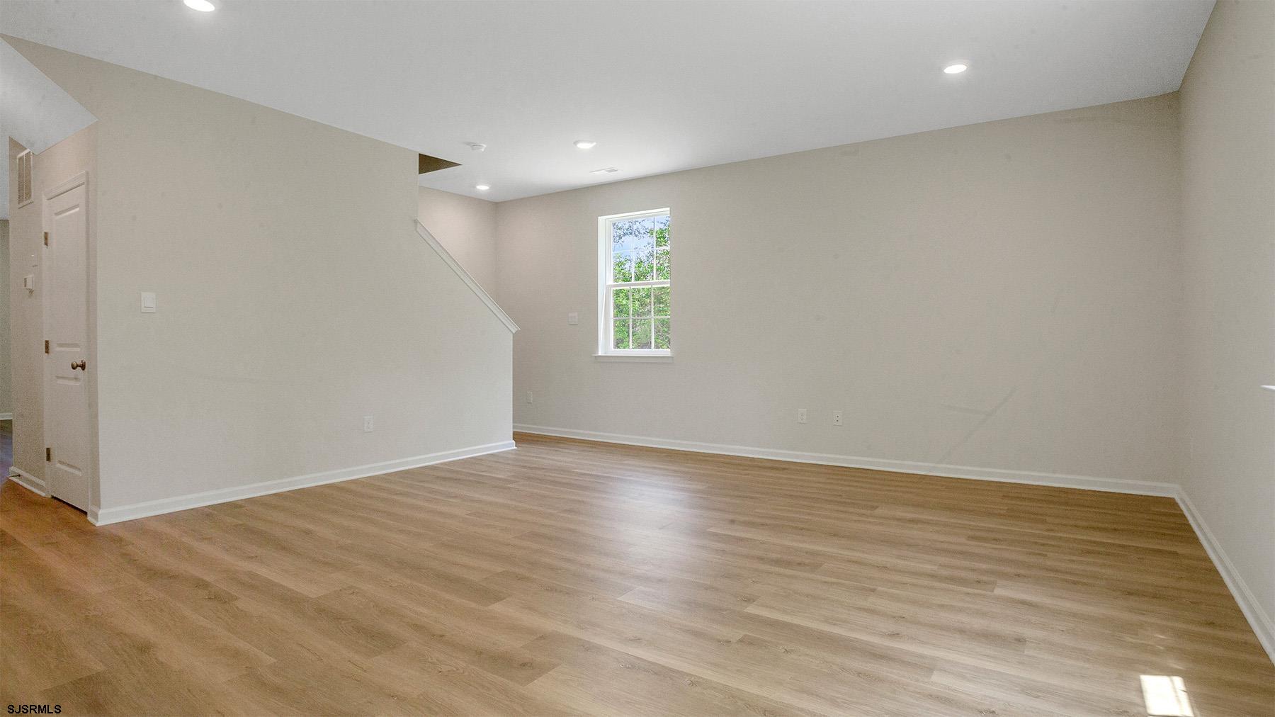 7 Emilie Court Richland, NJ 08350 - Photo 12 of 23 a view of an empty room with wooden floor and a window