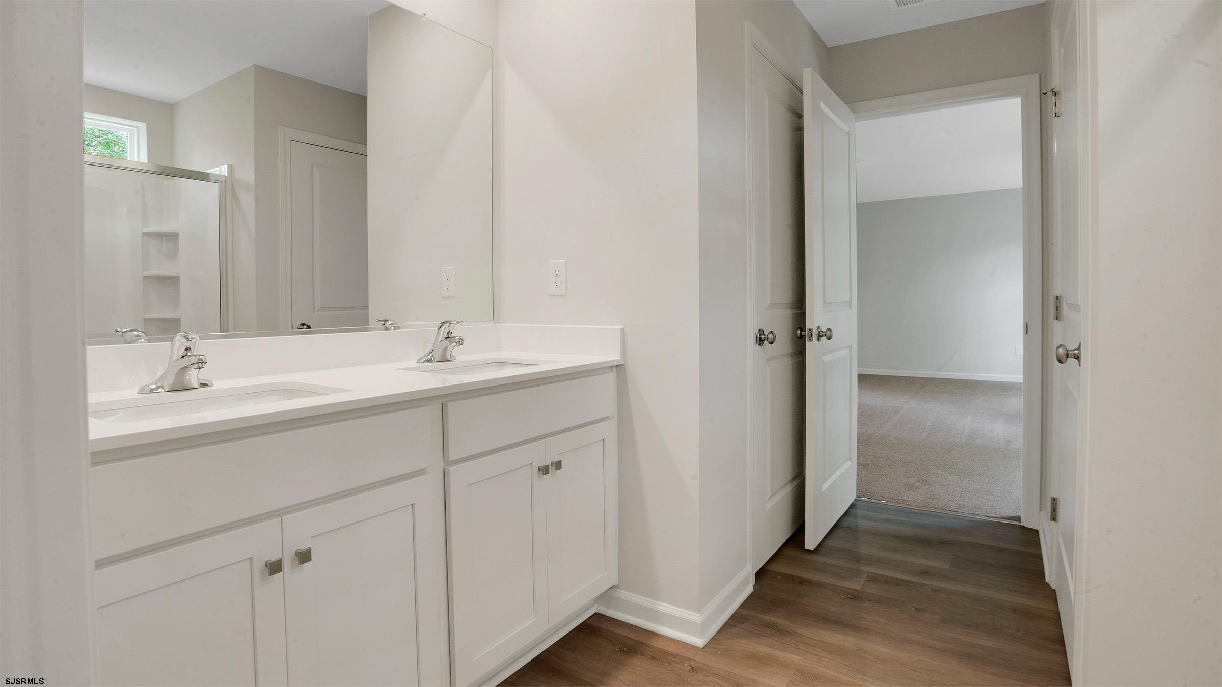 7 Emilie Court Richland, NJ 08350 - Photo 20 of 23 a bathroom with a double vanity sink and mirror