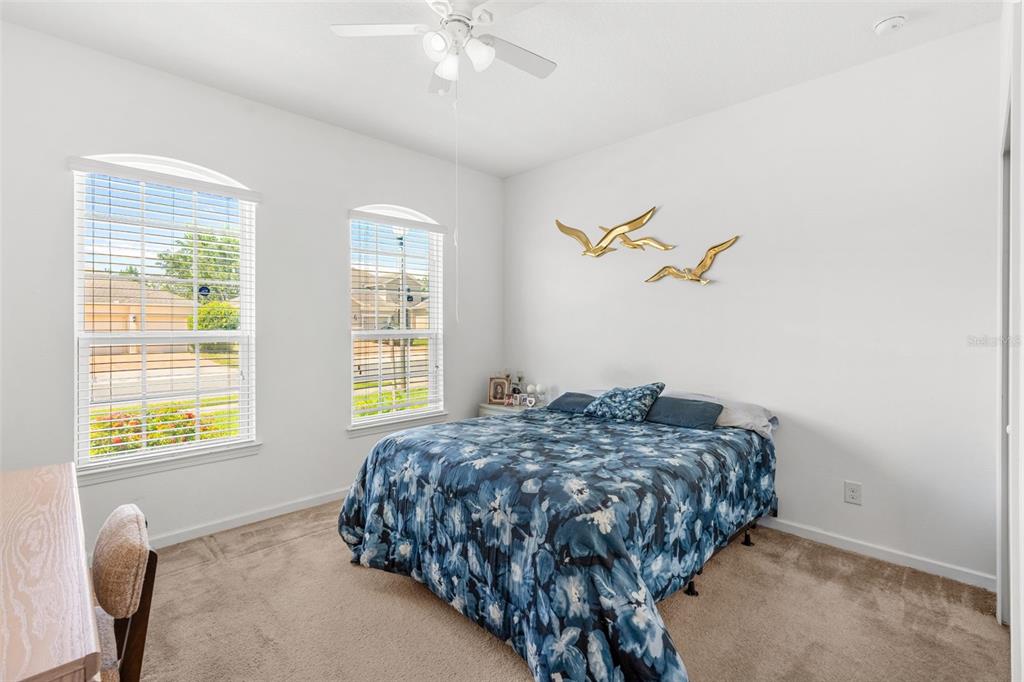 2085 Lula Road Minneola, FL 34715 - Photo 9 of 39 a bedroom with a bed and a window