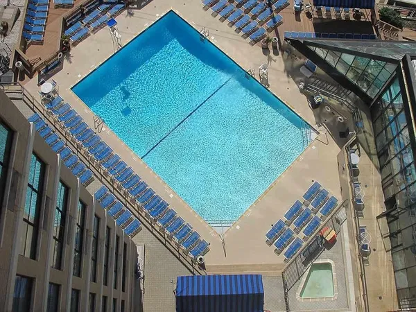 a view of a swimming pool and a patio