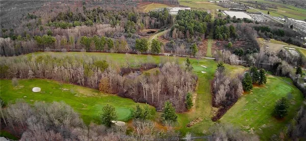 an aerial view of a house with a swimming pool