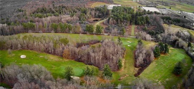 an aerial view of a house with a swimming pool