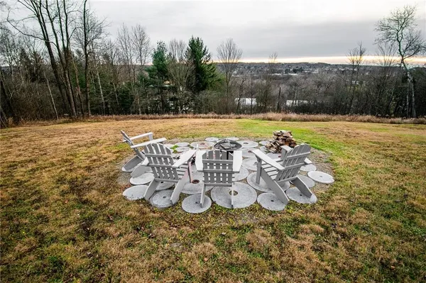 a view of a swimming pool with an outdoor space and seating area