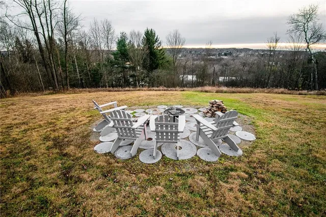 a view of a swimming pool with an outdoor space and seating area