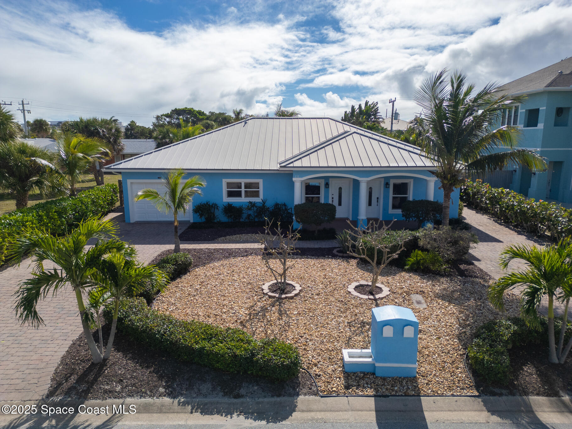 a front view of house with yard outdoor seating and barbeque oven