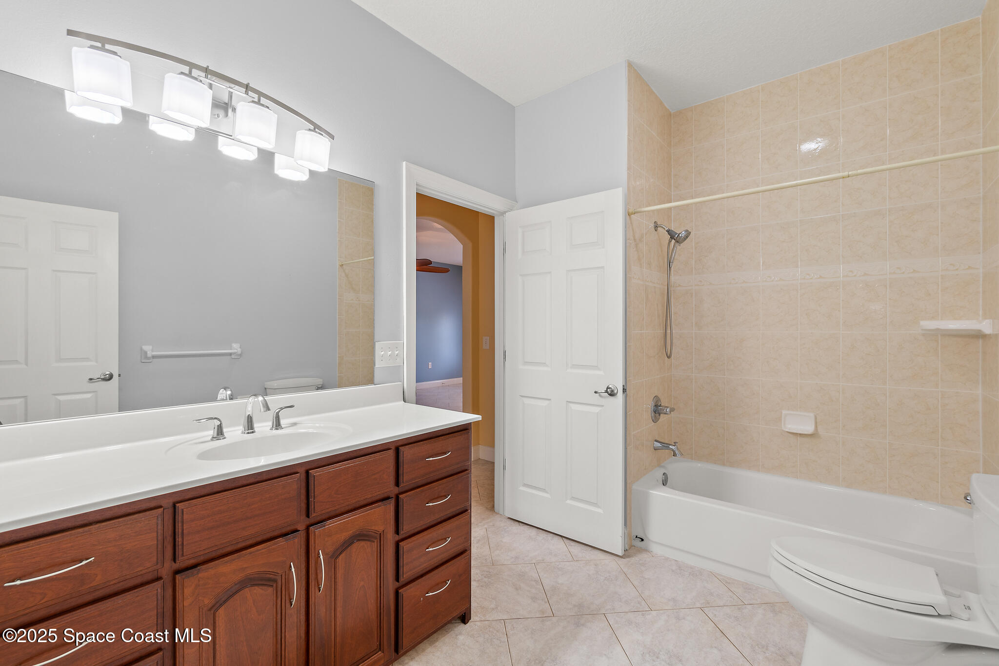 131 Harding Avenue, Unit 131 & 129 Cocoa Beach, FL 32931 - Photo 11 of 47 a bathroom with a sink a toilet and shower