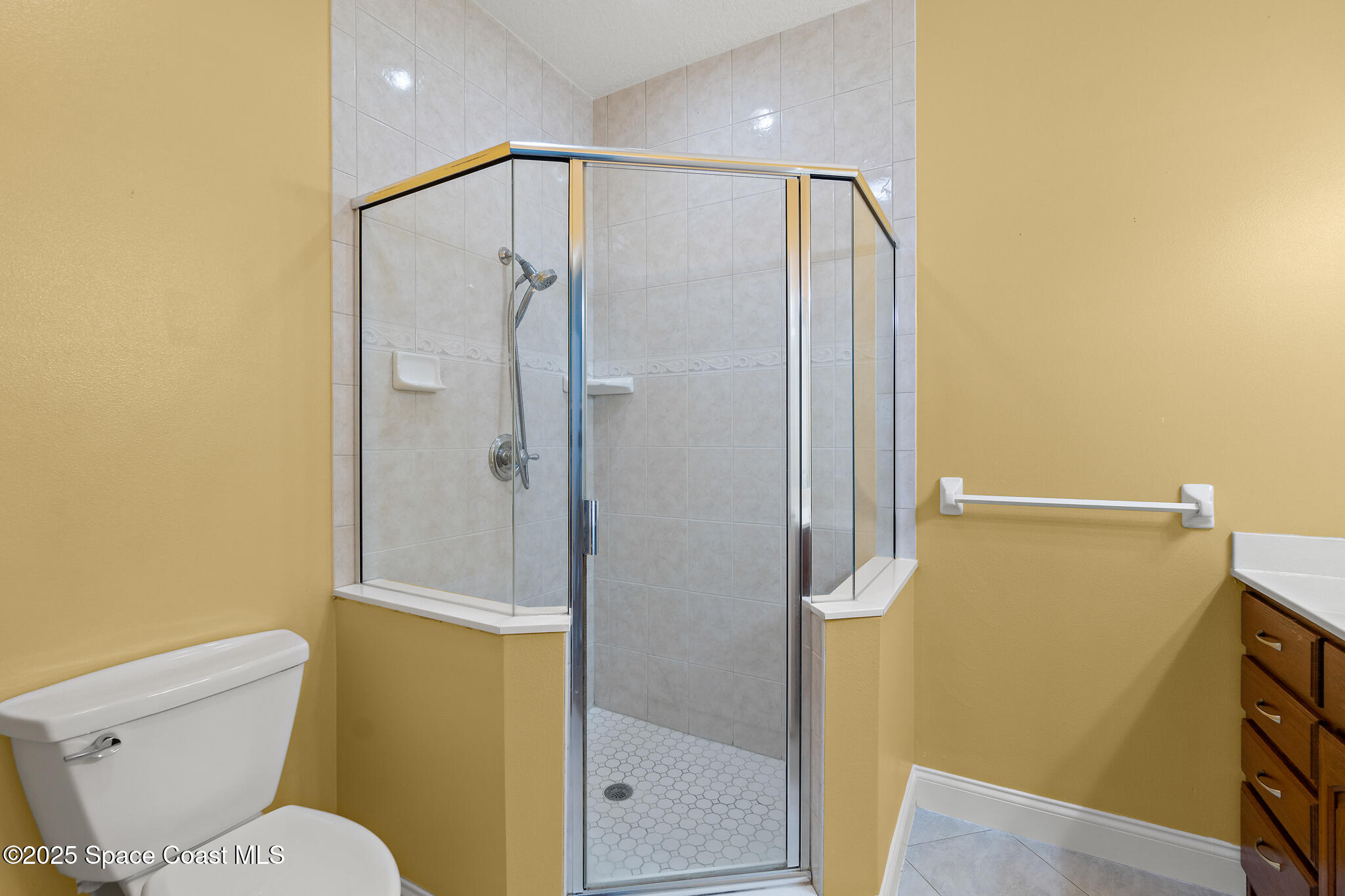 131 Harding Avenue, Unit 131 & 129 Cocoa Beach, FL 32931 - Photo 14 of 47 a bathroom with a shower and a toilet
